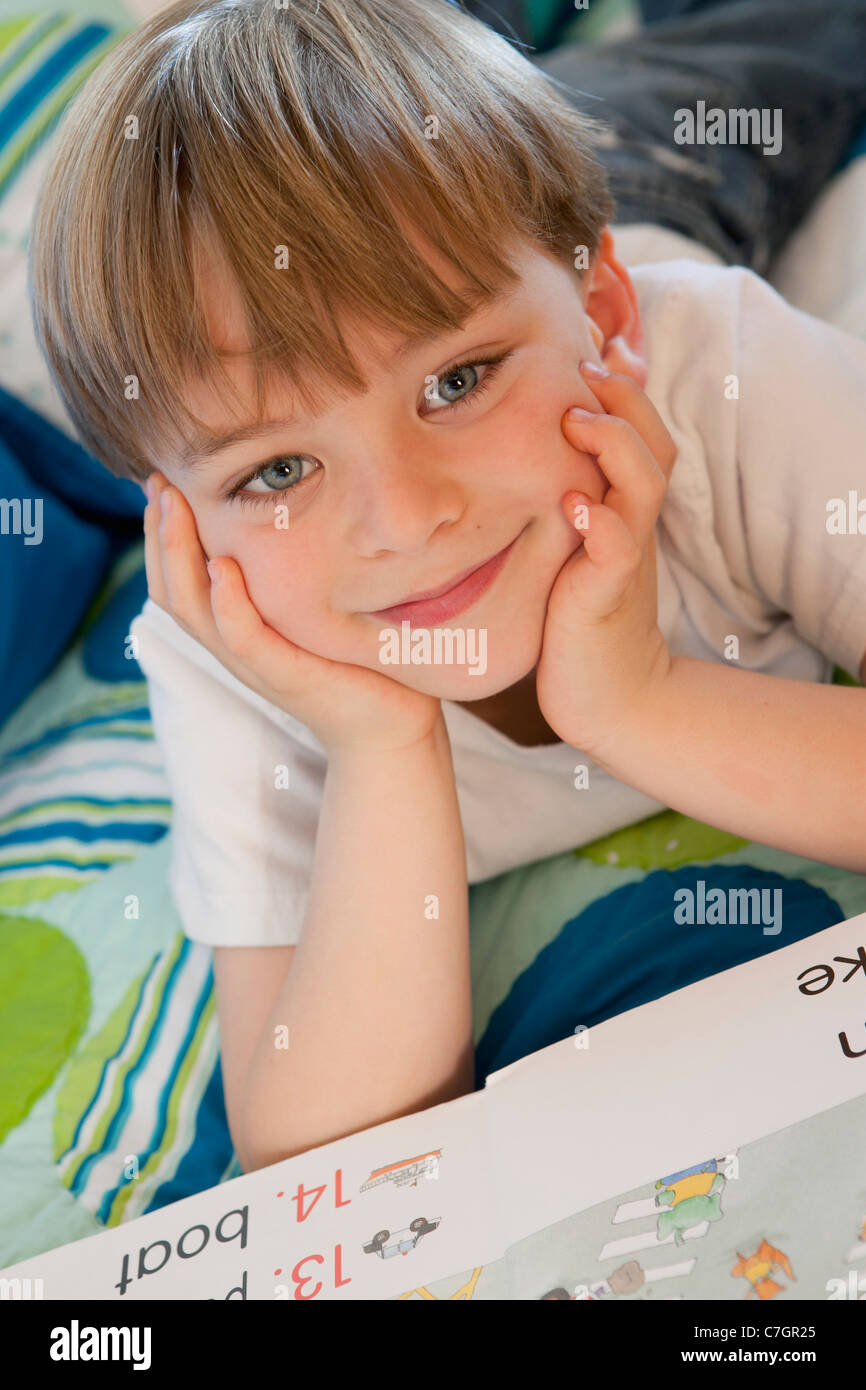 Portrait of a boy with a book Stock Photo - Alamy