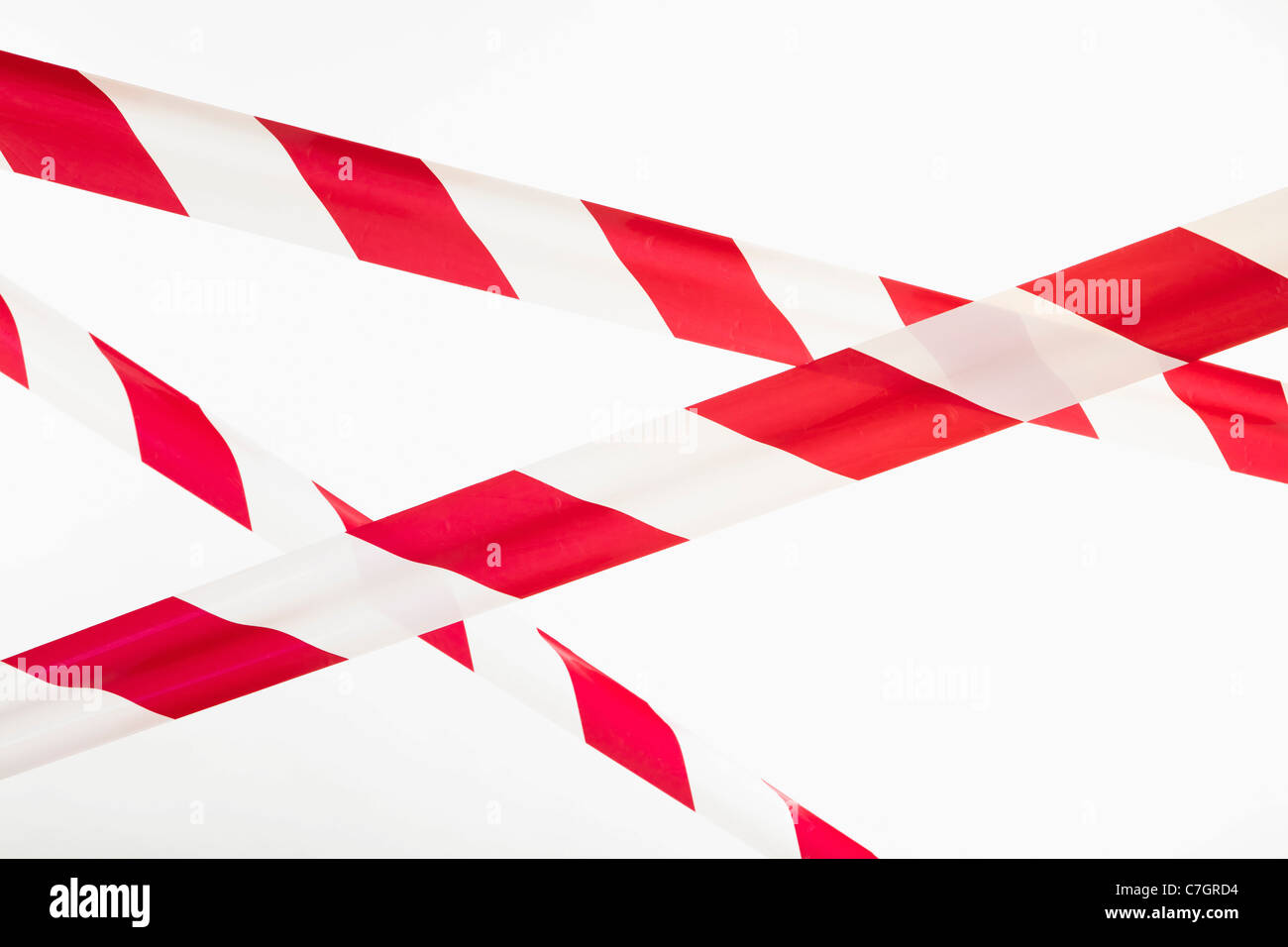 Crisscrossed Red And White Striped Cordon Tape Stock Photo