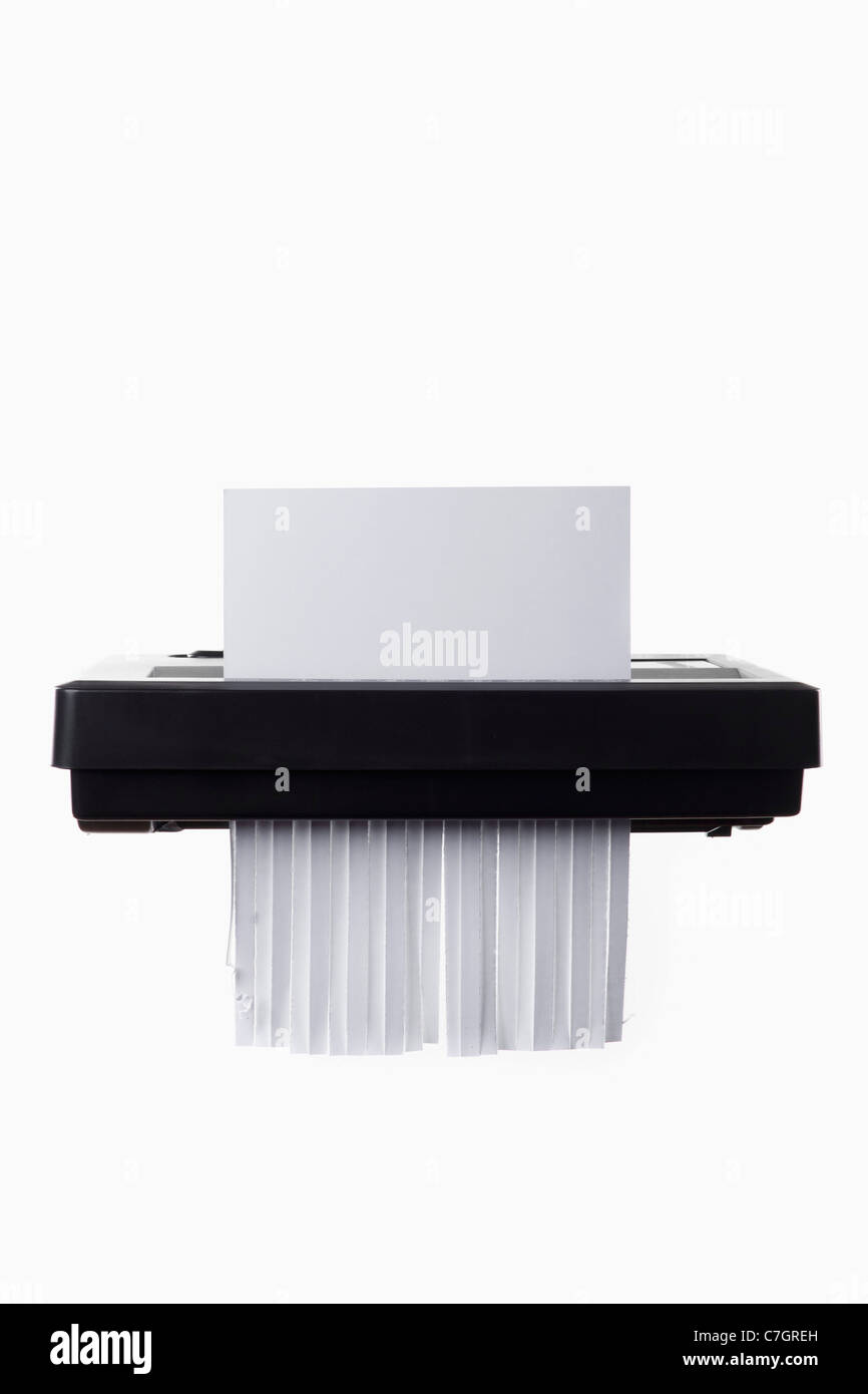 A blank document in a paper shredder Stock Photo