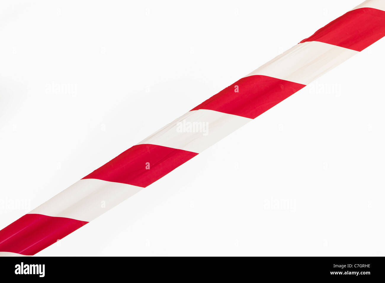 A single strip of red and white striped cordon tape Stock Photo Alamy