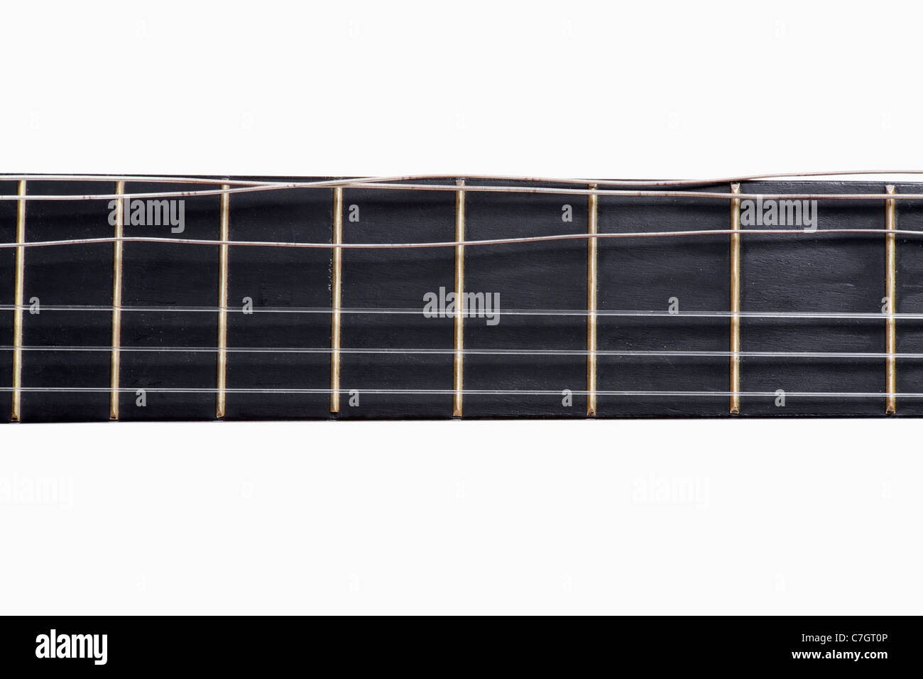 An acoustic guitar fretboard with a damaged string, closeup Stock Photo Alamy