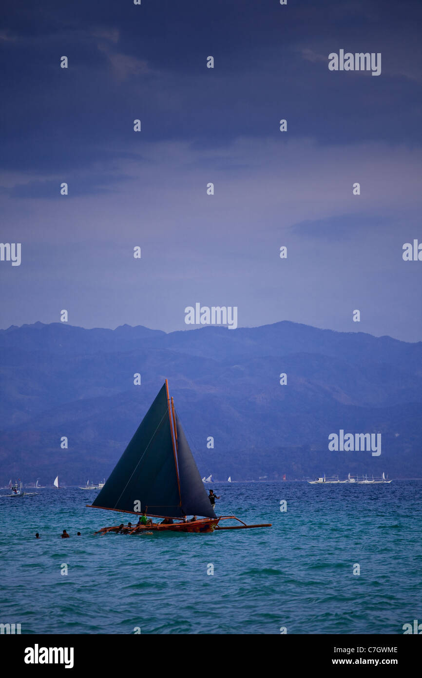 Sailing boat in the bay at White Beach, Boracay, Philippines Stock
