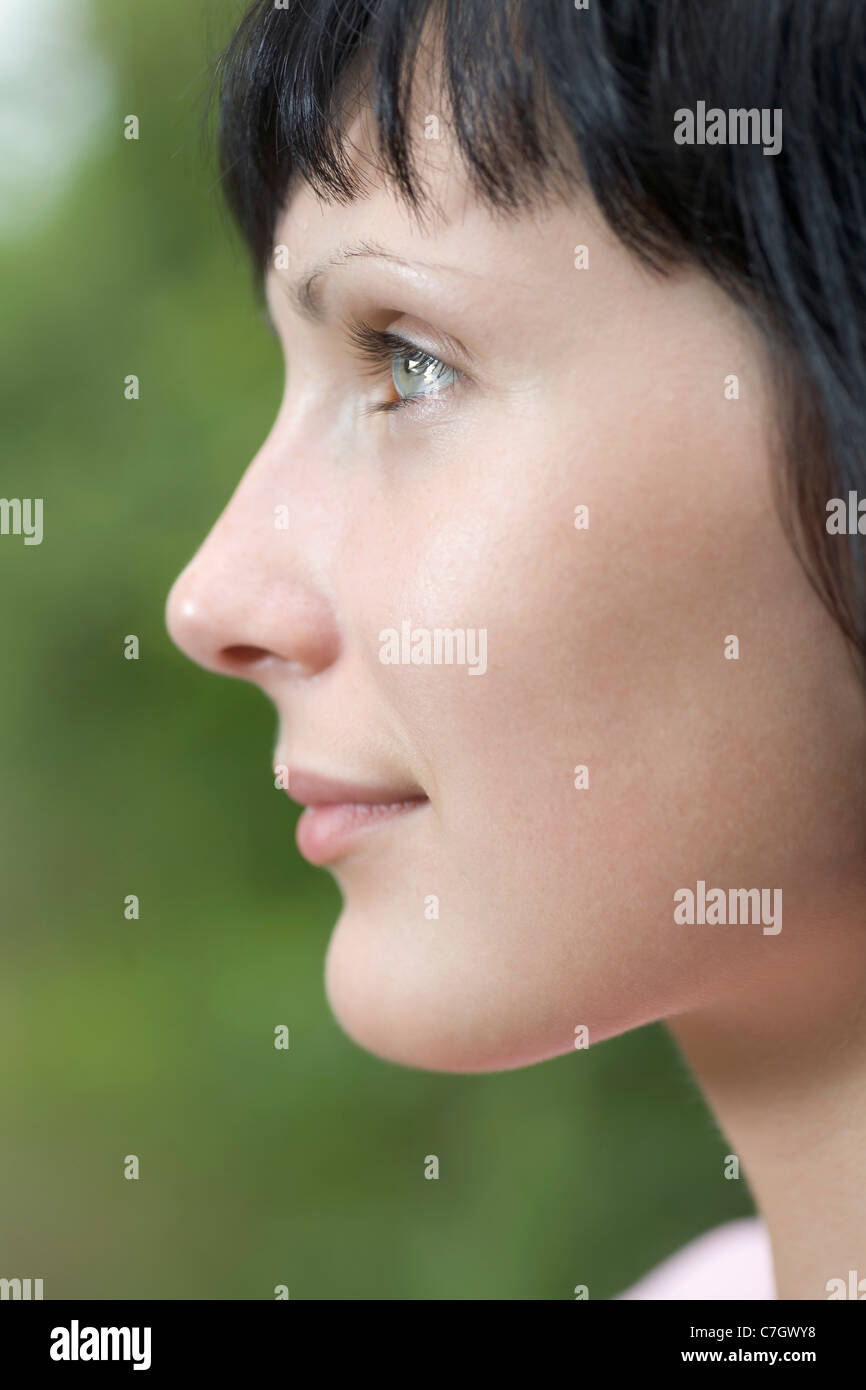 A woman looking off camera, close-up Stock Photo