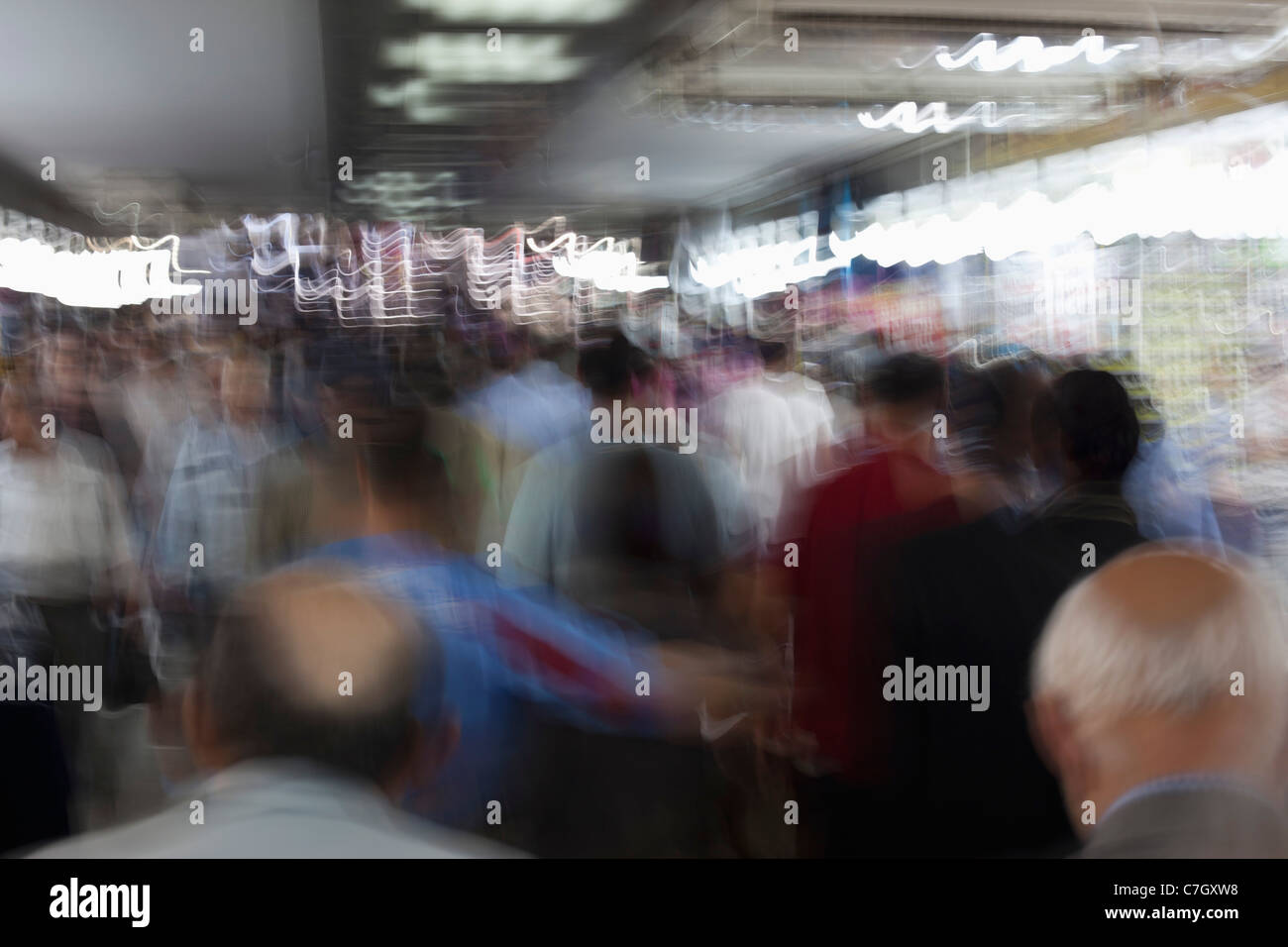A crowd of men on the move, rear view Stock Photo