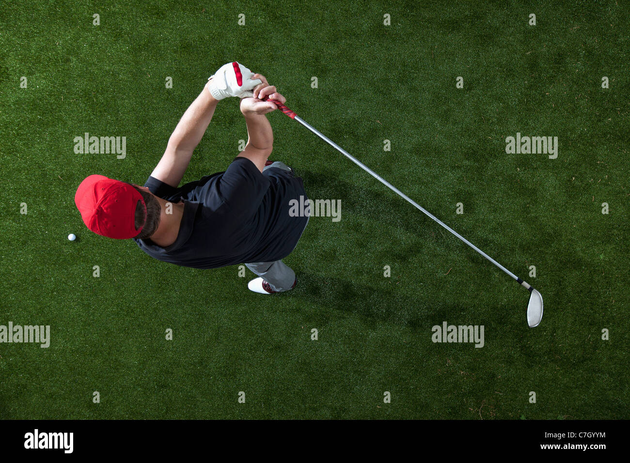 A golfer swinging a golf club, overhead view Stock Photo - Alamy