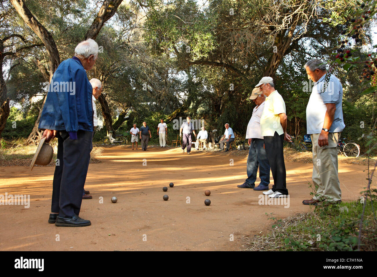 A group of old gentlemen playing a traditional game with metallic  balls called "Abali", Preveza town, Epirus, Greece Stock Photo