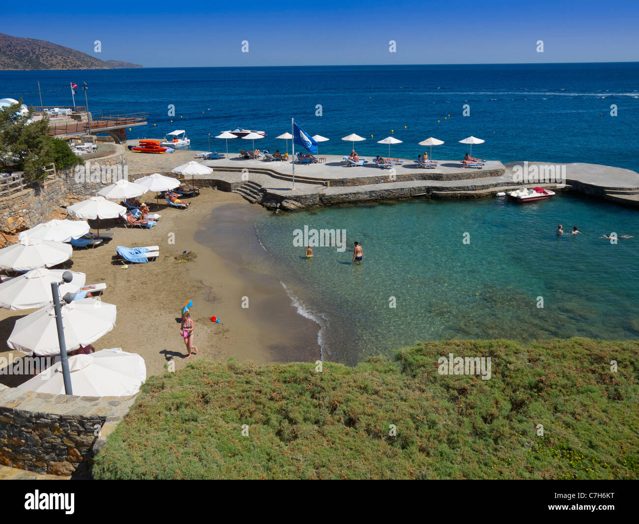 The man made beach and jetty at the luxury resort of the St Nikolaos Bay Hotel on the outskirts of Agios Nikolaos on Crete Stock Photo