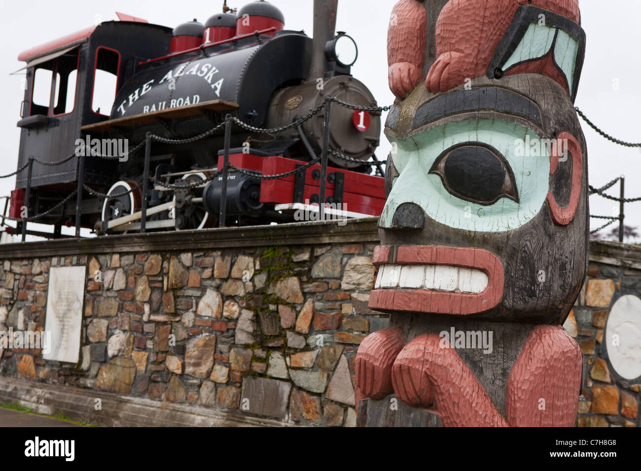 Totem pole with Alaska Railroad historic engine, Anchorage, Alaska