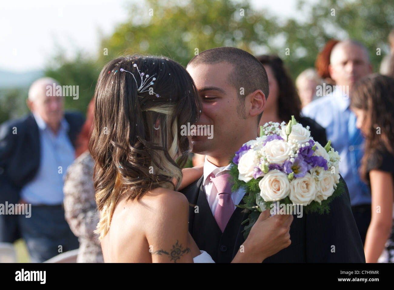 bride and groom kissing at wedding party Stock Photo - Alamy