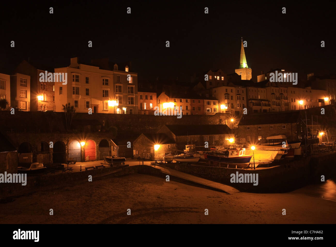 Tenby Harbour illuminated at night, Tenby, Pembrokeshire, Wales Stock Photo