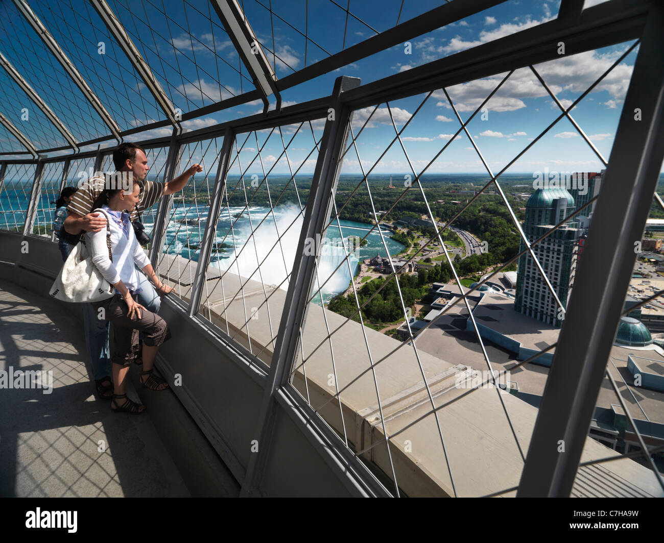 Young tourist couple enjoying view from Skylon tower at Niagara Falls, Ontario, Canada. Stock Photo