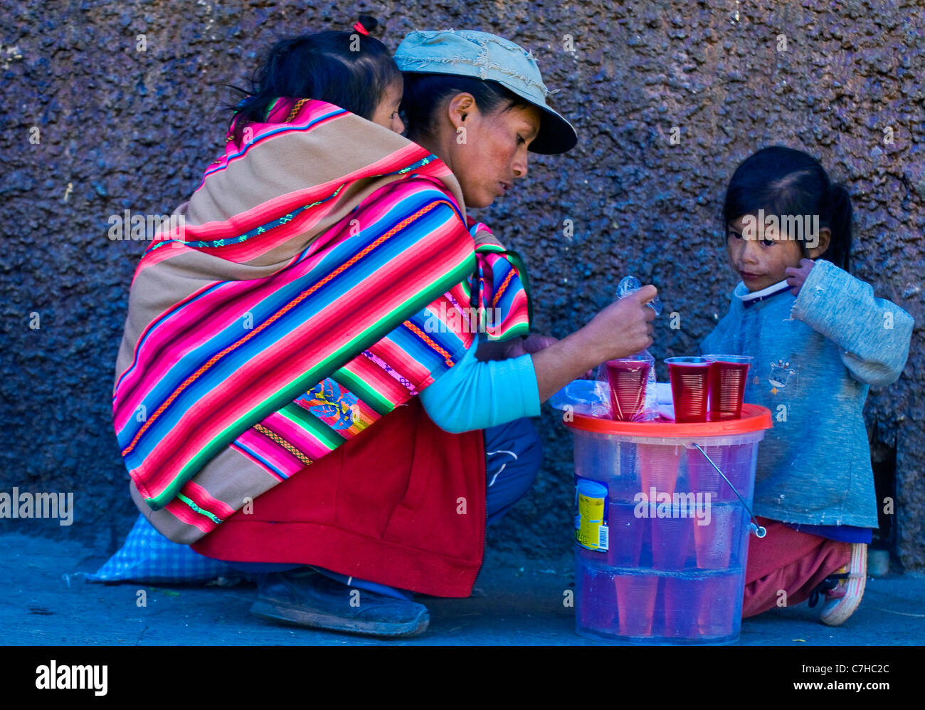 Peruvian woman with here child in a market in Cusco Peru Stock Photo