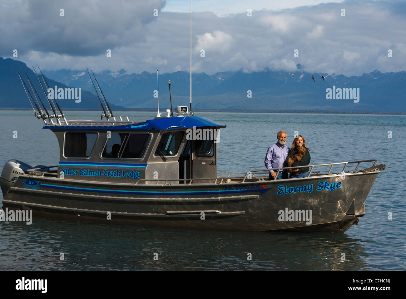 Owners of Silver Salmon Creek lodge in their boat Stormy Skye, Alaska Maritime National Wildlife Refuge, Alaska, United States Stock Photo