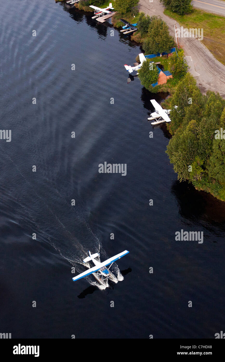 Aerial view of a floatplane landing on Lake Hood, Anchorage, Alaska