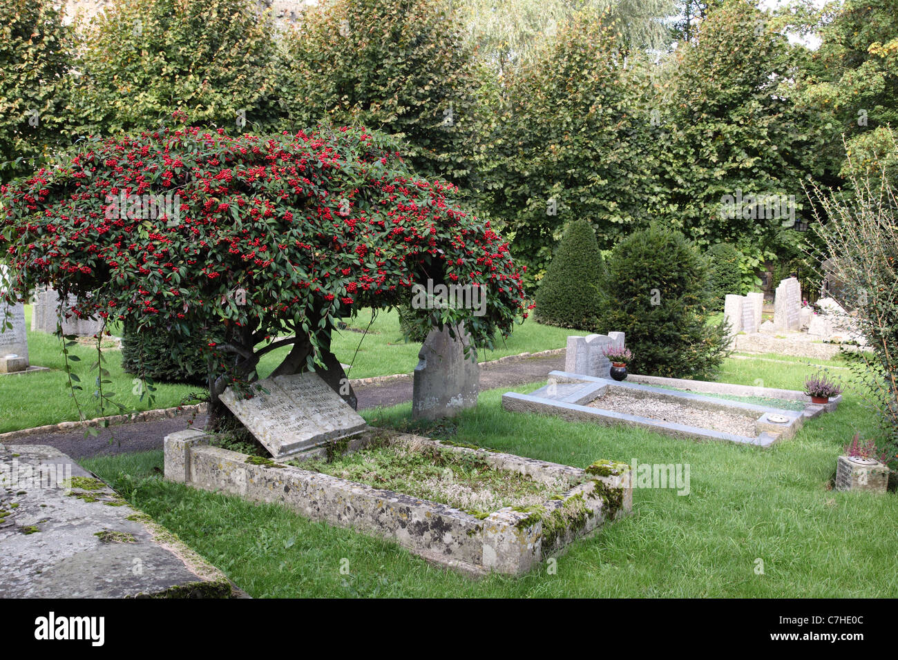 Graveyard at All Saints Church, Nunney, Somerset, England, UK Stock Photo