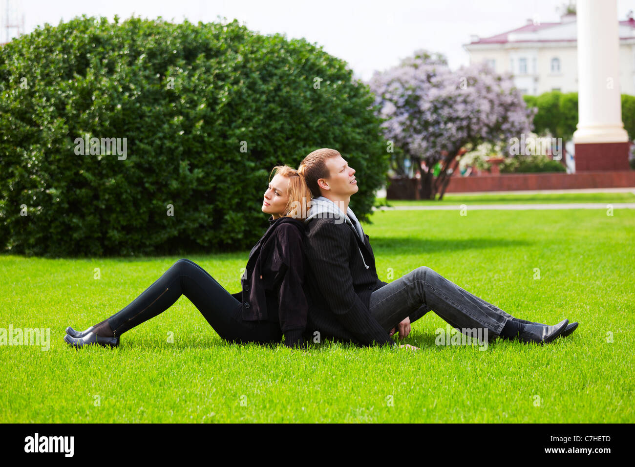 Happy young couple in a city park Stock Photo - Alamy