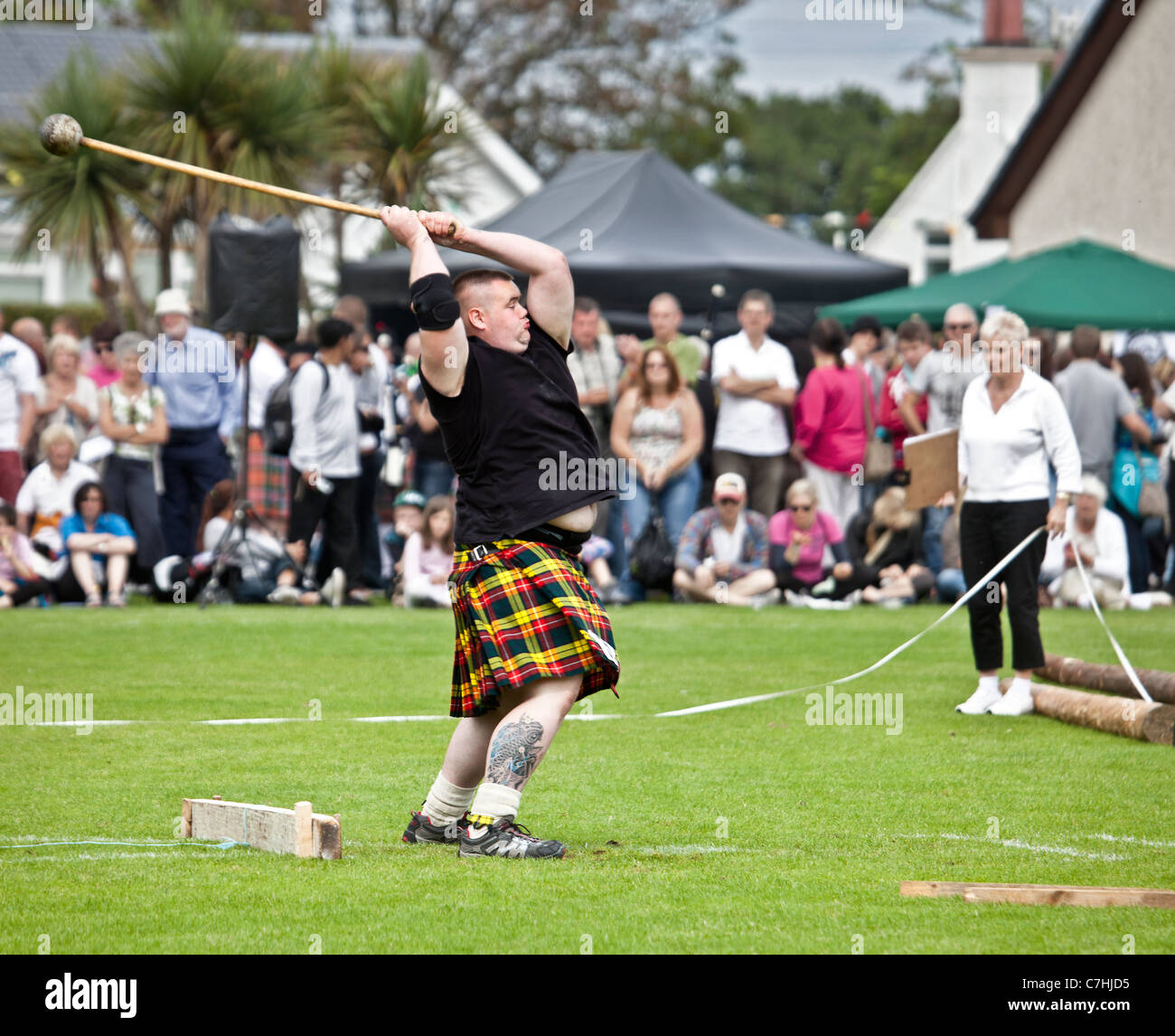 'Heavy' athlete throwing the Hammer, Scots Standing Style, at Brodick Highland Games, Isle of Arran Stock Photo