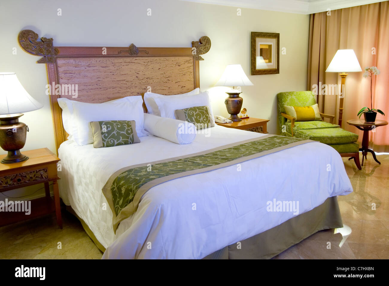 Interior of a hotel suite room showing a king sized bed Stock Photo Alamy