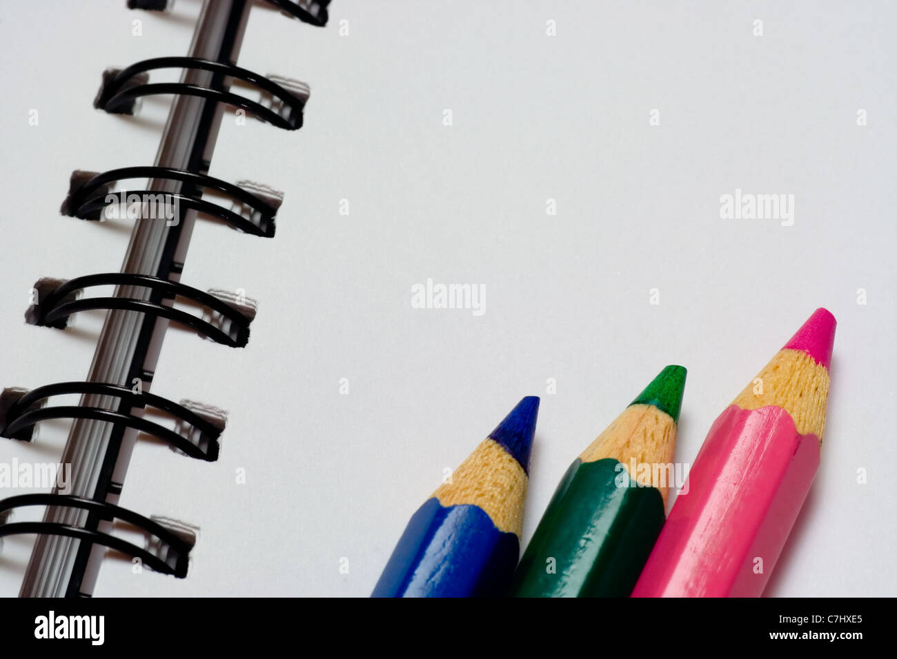 Closeup of some color pencils on a notepad Stock Photo