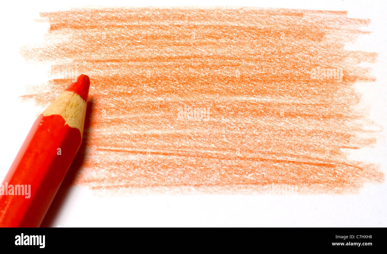 Red color pencil with coloring on a piece of paper Stock Photo