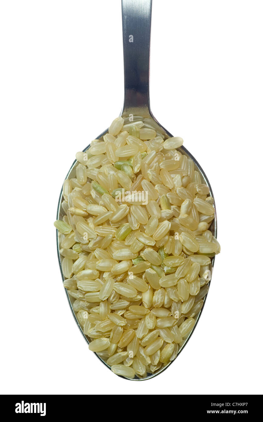 Spoonful of short grain rice isolated on white background Stock Photo