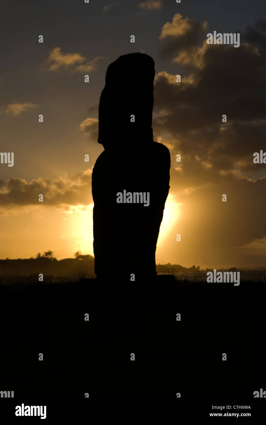 Ahu Riata single moai at sunset on Hanga Piko Bay, restored 1990 Stock Photo