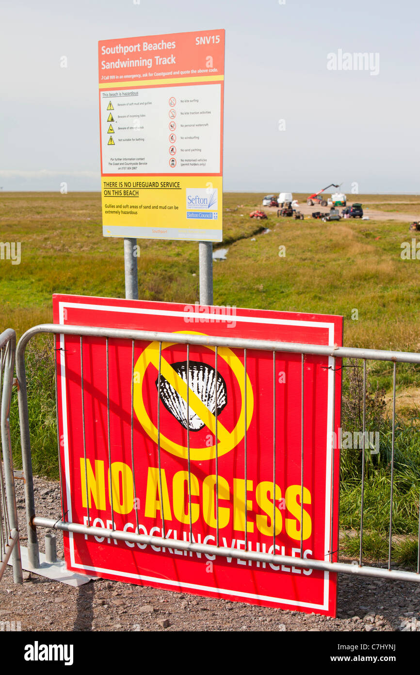 A sign for Cocklers exploiting the shell fish on the Ribble estuary near Southport, Lancashire, UK. Stock Photo