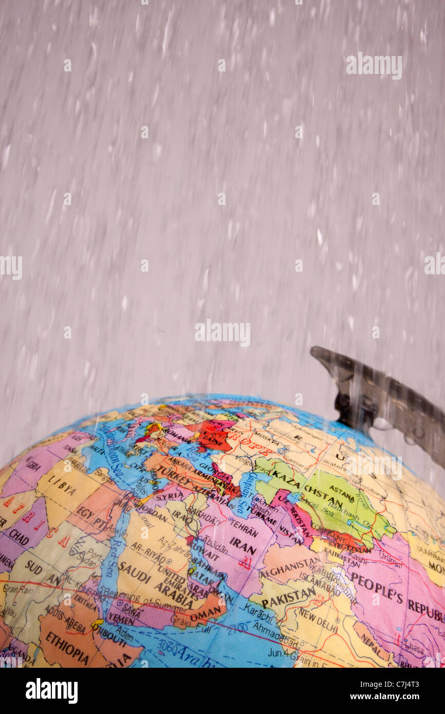 Wet globe over white Stock Photo - Alamy