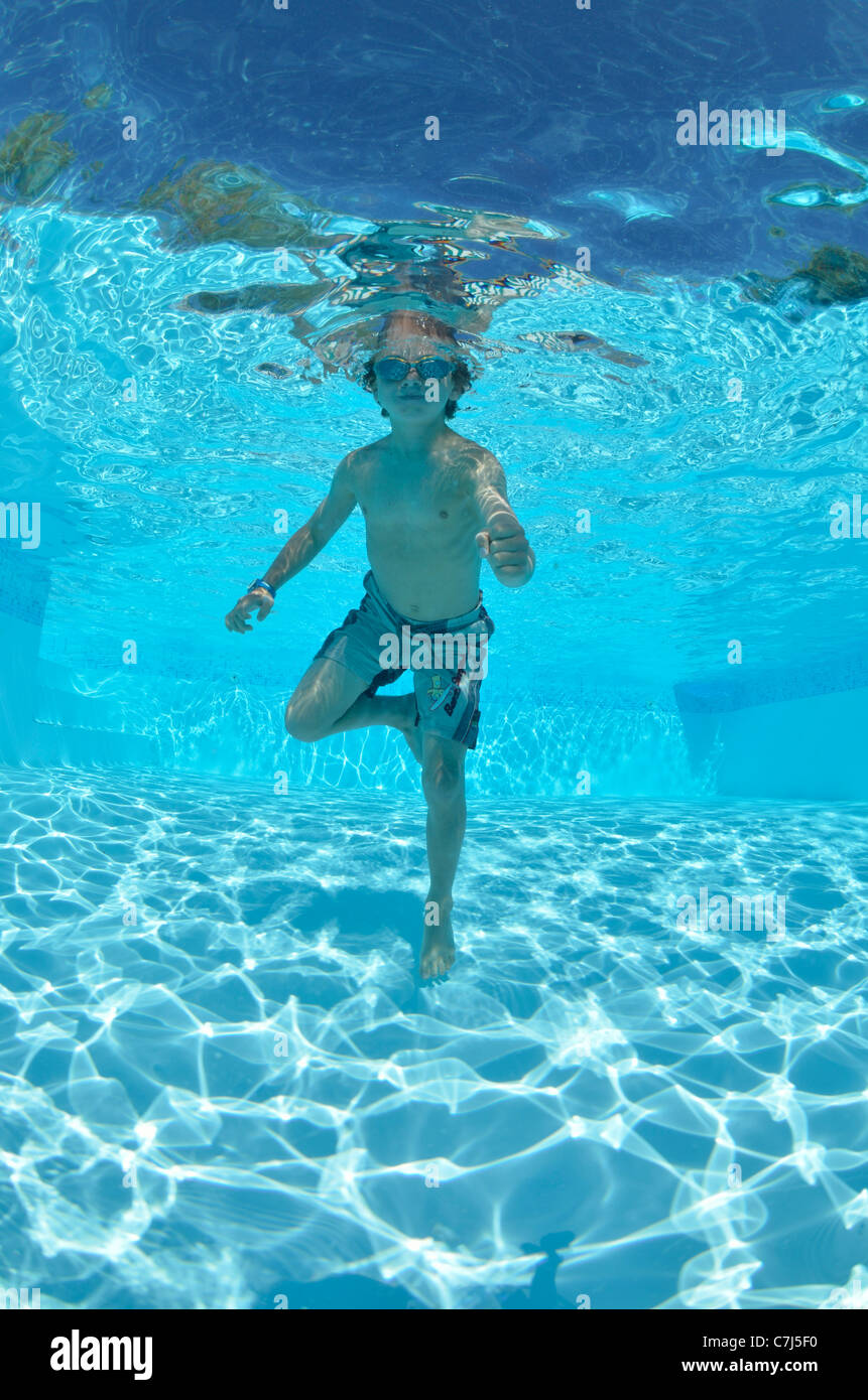 Boy swimming underwater in pool hi-res stock photography and images - Alamy