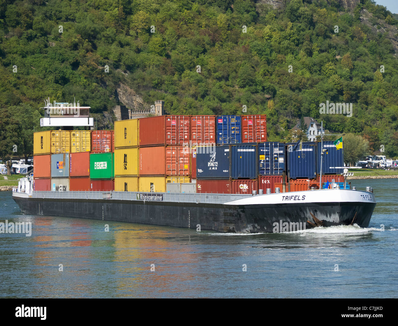 Large barge carrying container freight sailing up the River Rhine in Germany Stock Photo