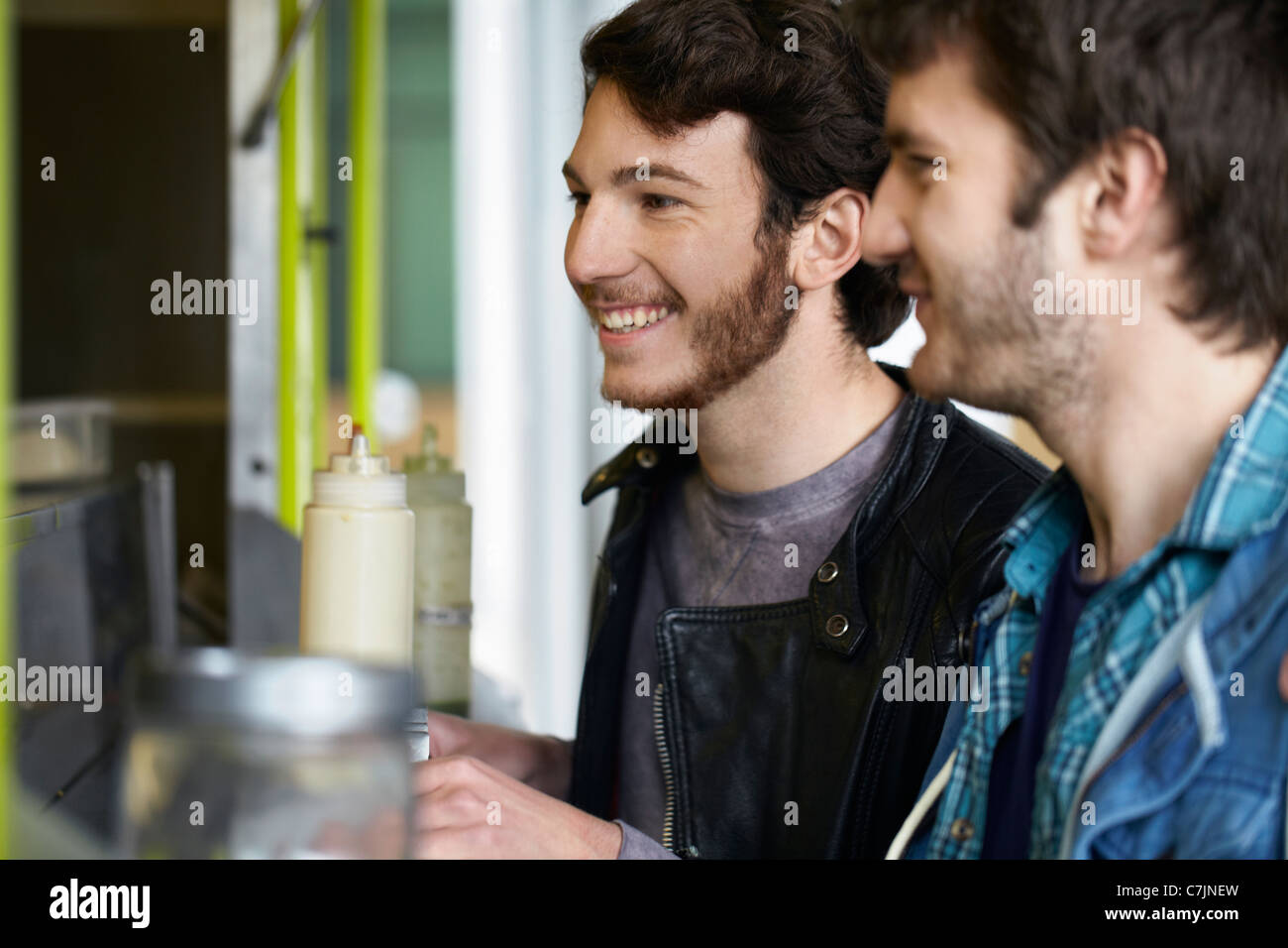 Men ordering from food cart Stock Photo