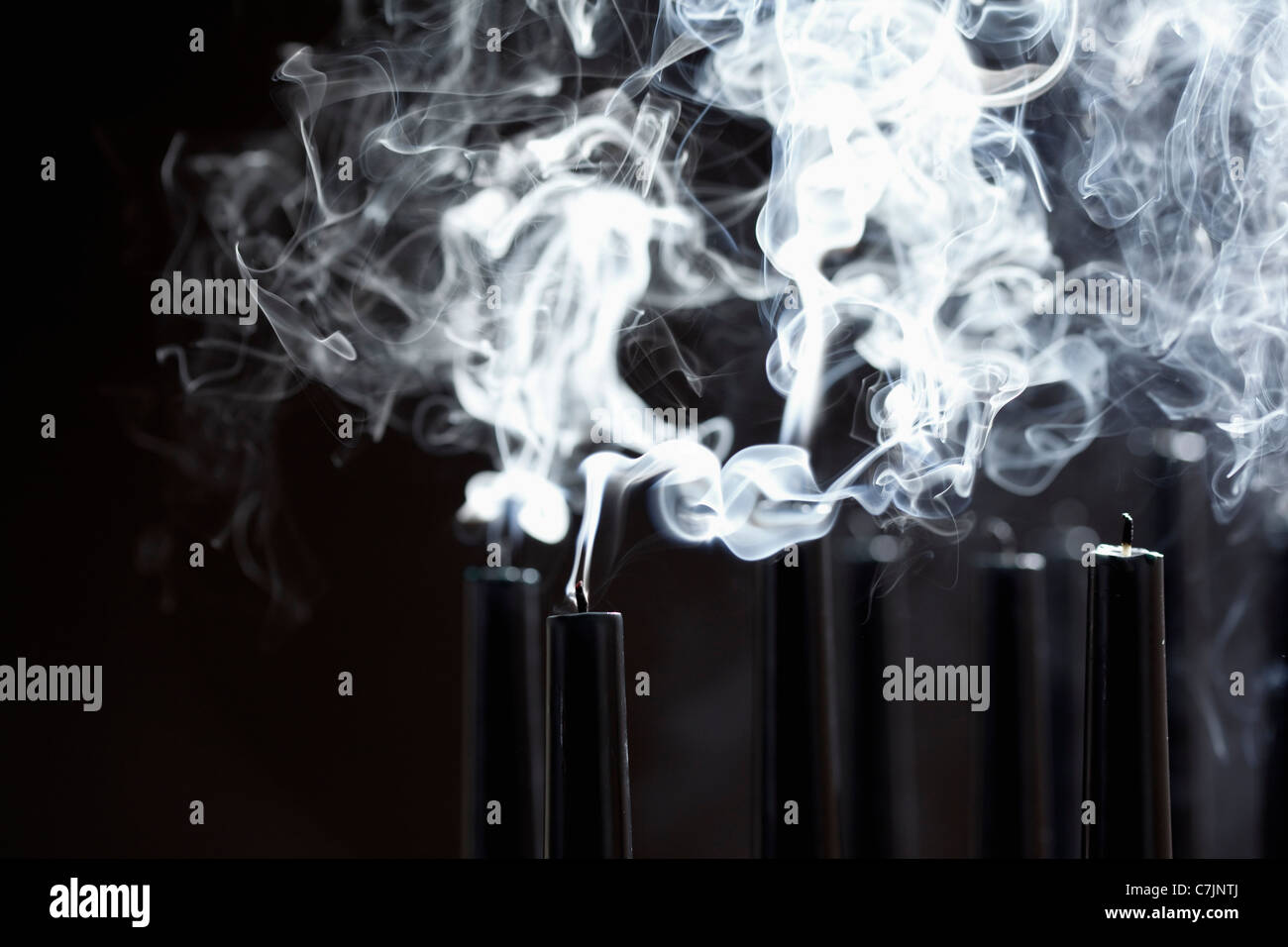 Close up of smoking black candles Stock Photo Alamy