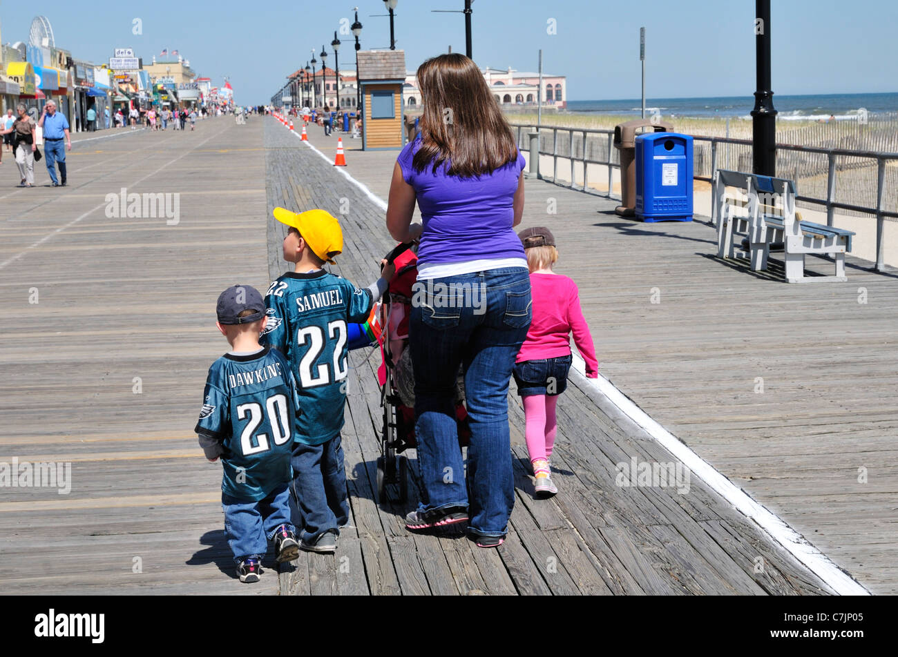 People walking on the boardwalk in Long Branch, New Jersey Stock