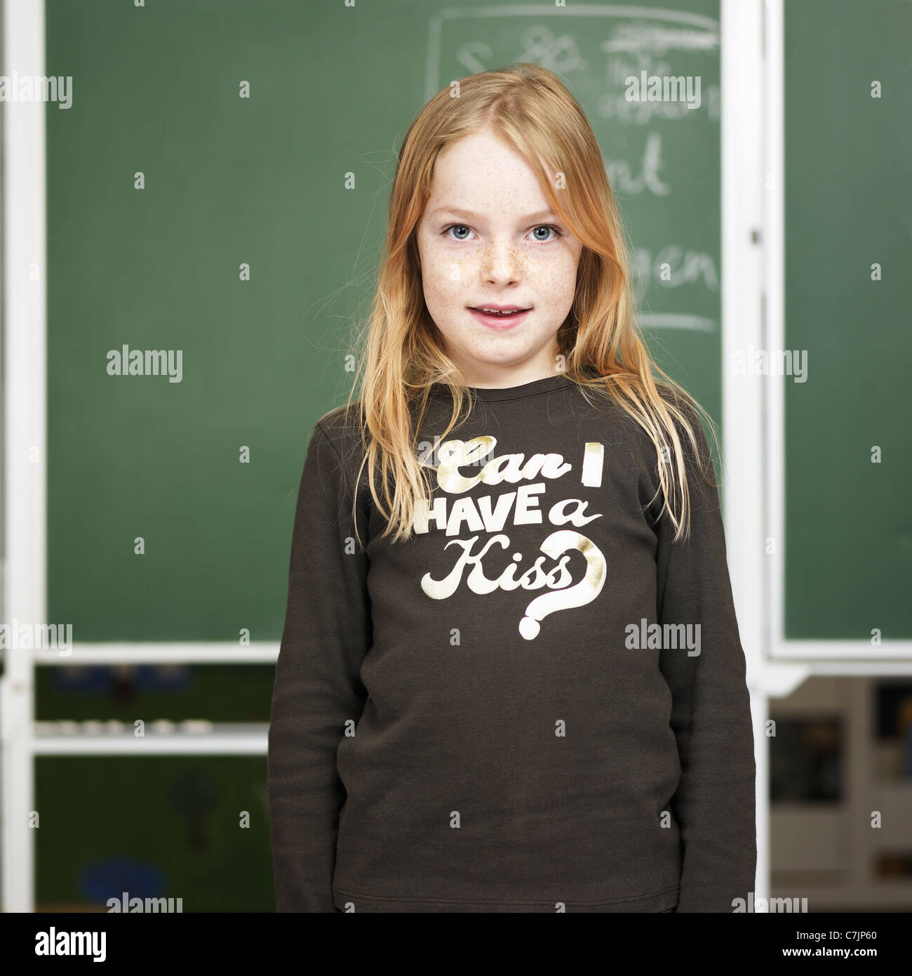 Young girl smiling in classroom Stock Photo - Alamy