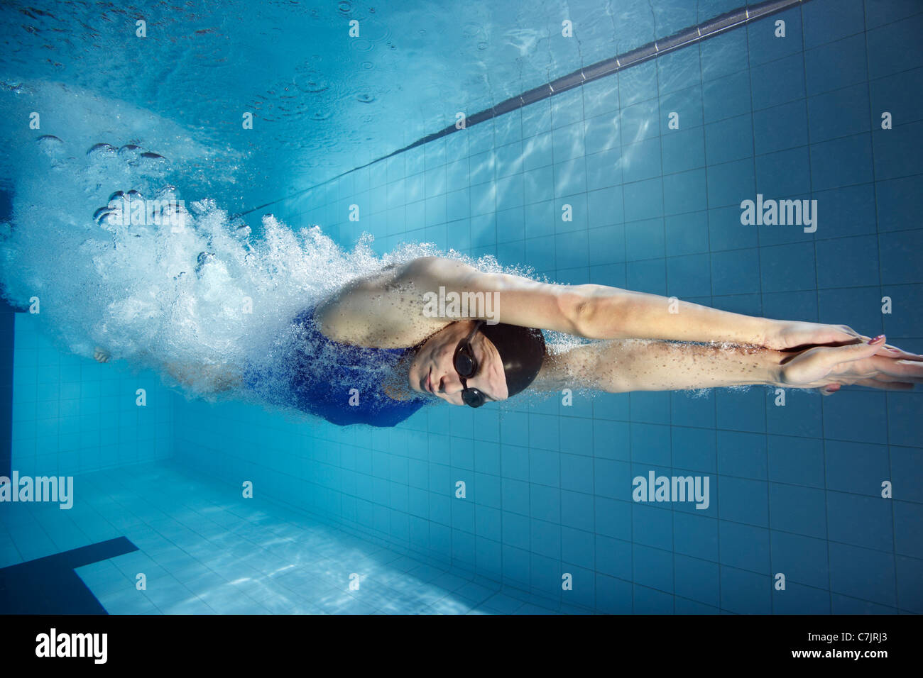 Swimmer diving into pool Stock Photo Alamy