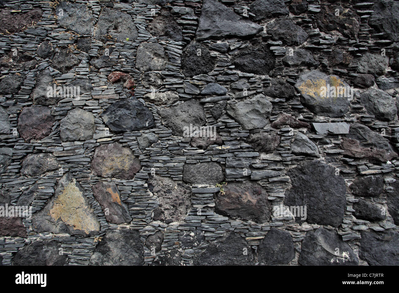 Old black stone wall, may be used as background Stock Photo Alamy