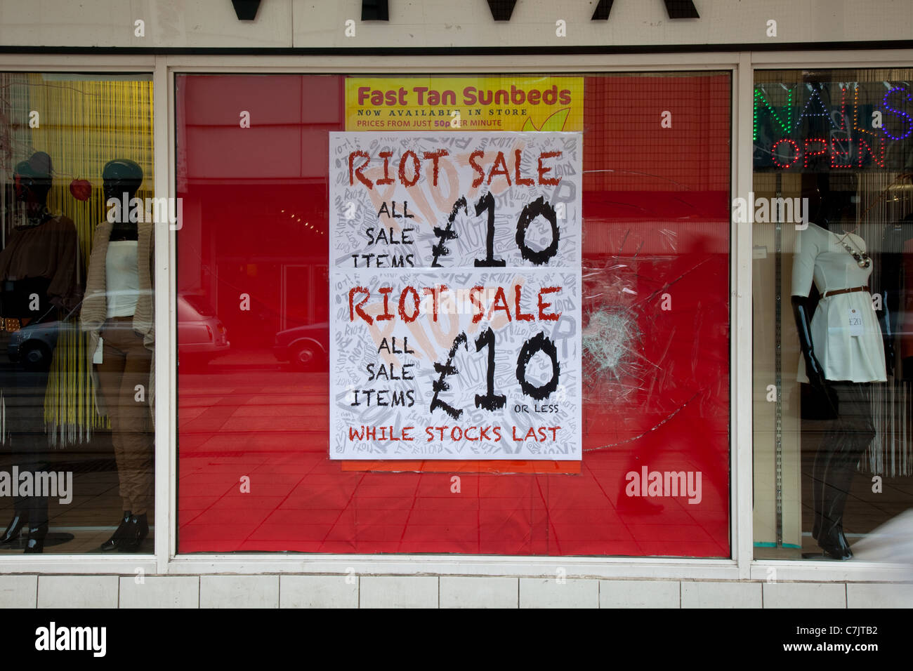 Riot Sale Shattered Glass Window in Manchester, UK Stock Photo