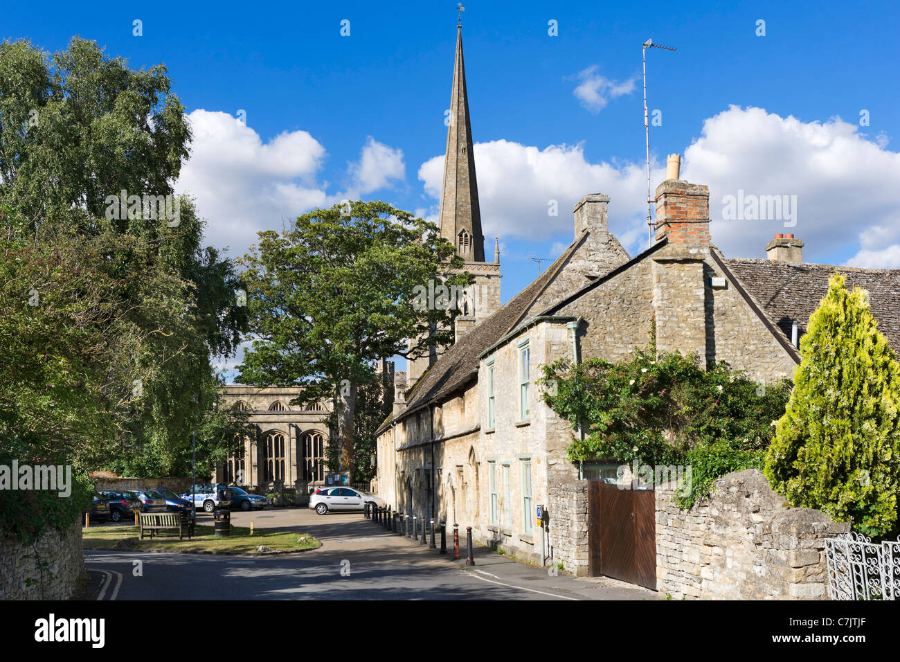 View towards St John the Baptist parish church on Church Lane in the Cotswold town of Burford, Oxfordshire, England, UK Stock Photo