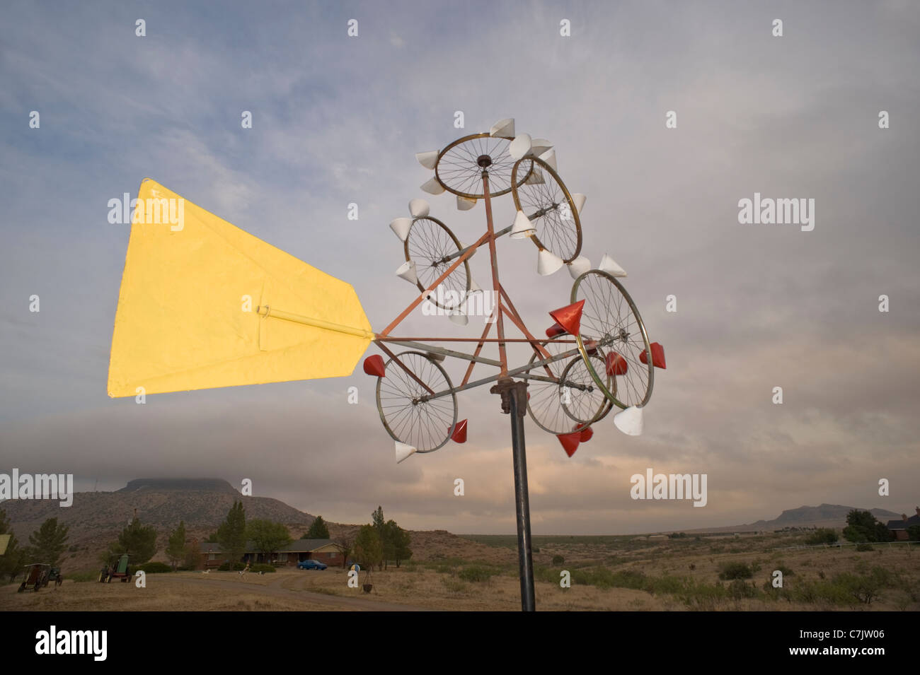 A whimsical whirligig art sculpture captures the eye on the outskirts of Tucumcari, New Mexico. Stock Photo