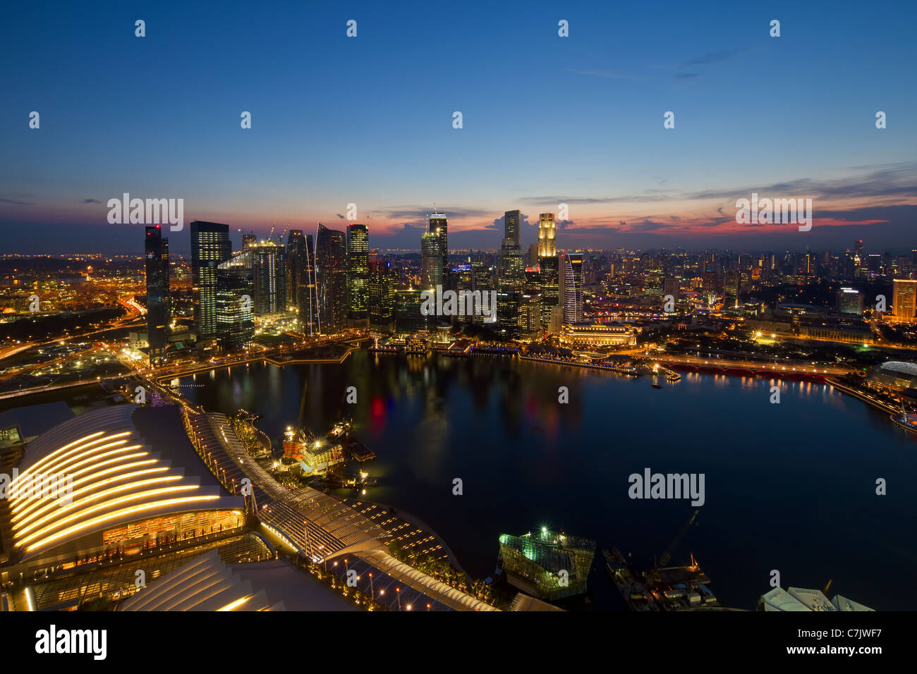Singapore Central Business District Skyline by River at Blue Hour Stock Photo