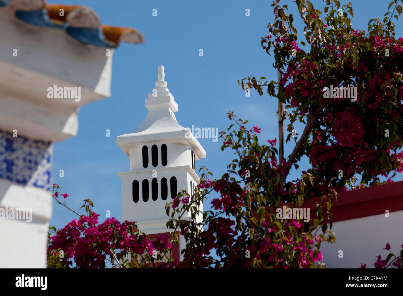 Portugal, Algarve, Alte, Flowers & Chimney Stock Photo