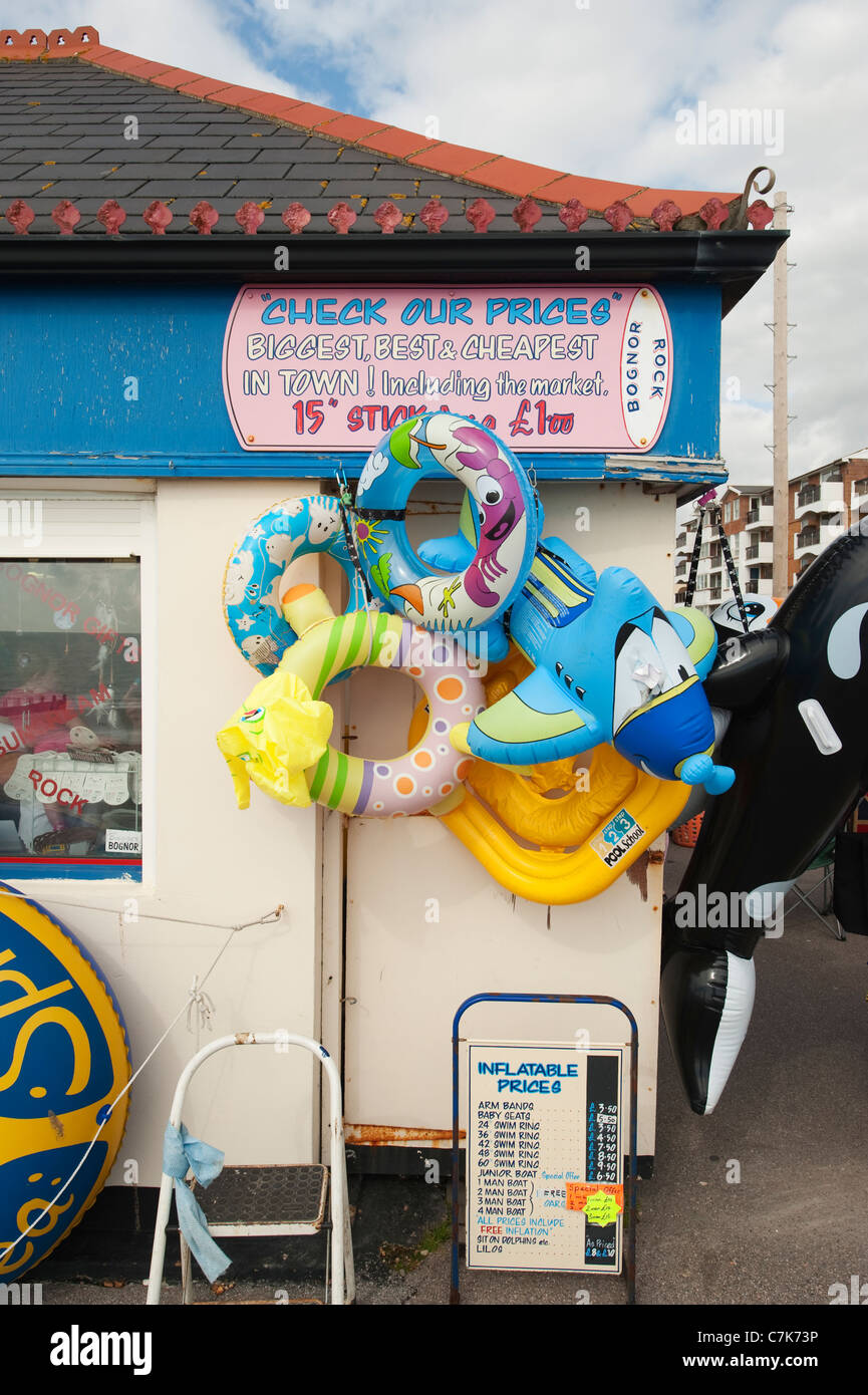 Seafront shop at Bognor Regis in West Sussex selling Inflatable Toys and Rock, with an Inflatable Prices sign. Stock Photo