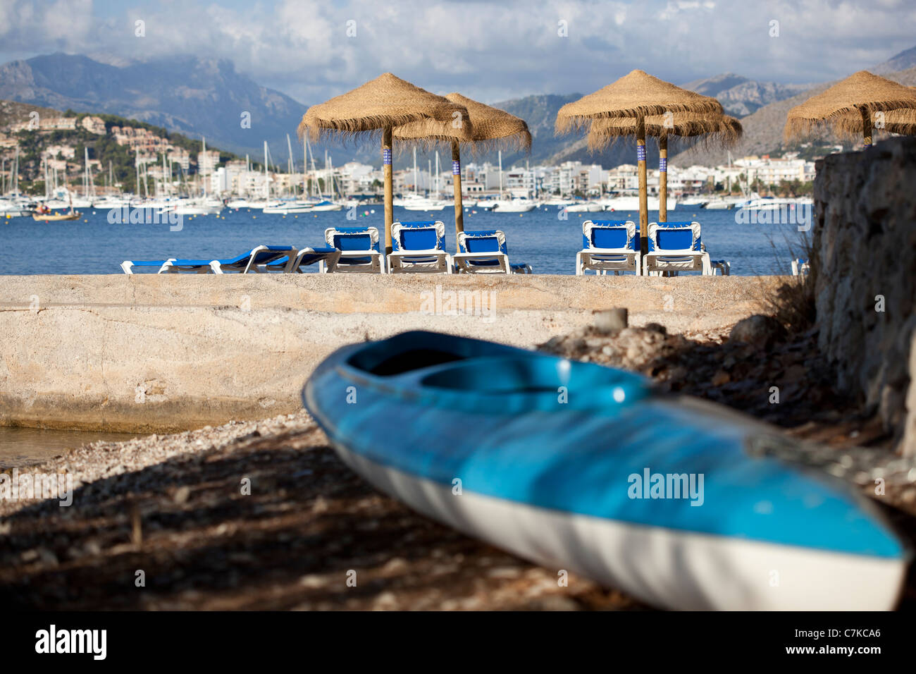 canoe on beach in Puerto Pollensa Majorca Mallorca Spain with sun beds