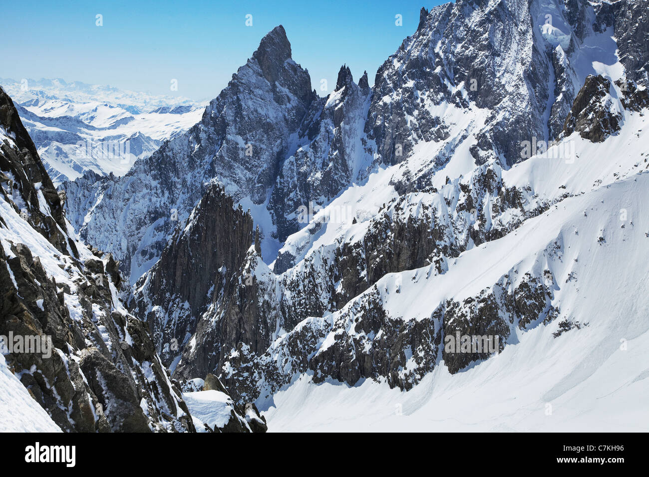Snow covered mountains and blue sky Stock Photo - Alamy