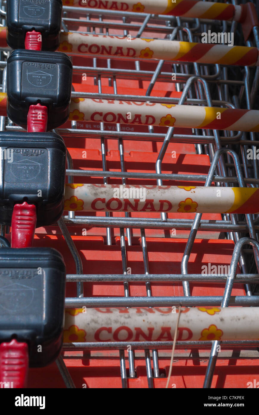 A detail of shopping cart handles at a Conad grocery store in Citta