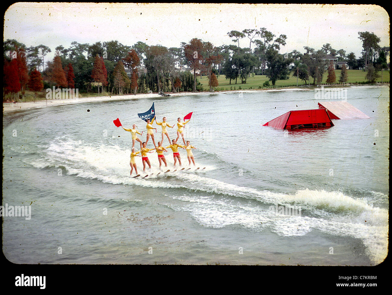 acrobatic skiers florida 1950s water lake women color slide Stock Photo