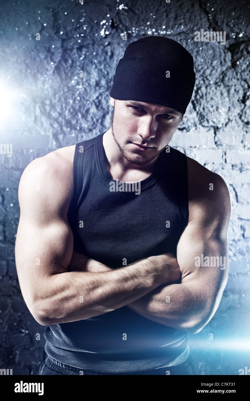 Young strong man portrait. With flash effect. Stock Photo