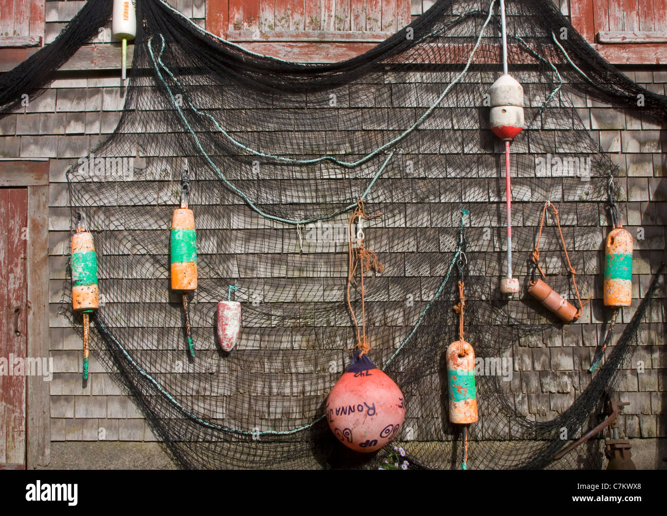 Old buoys on a exterior wall Stock Photo