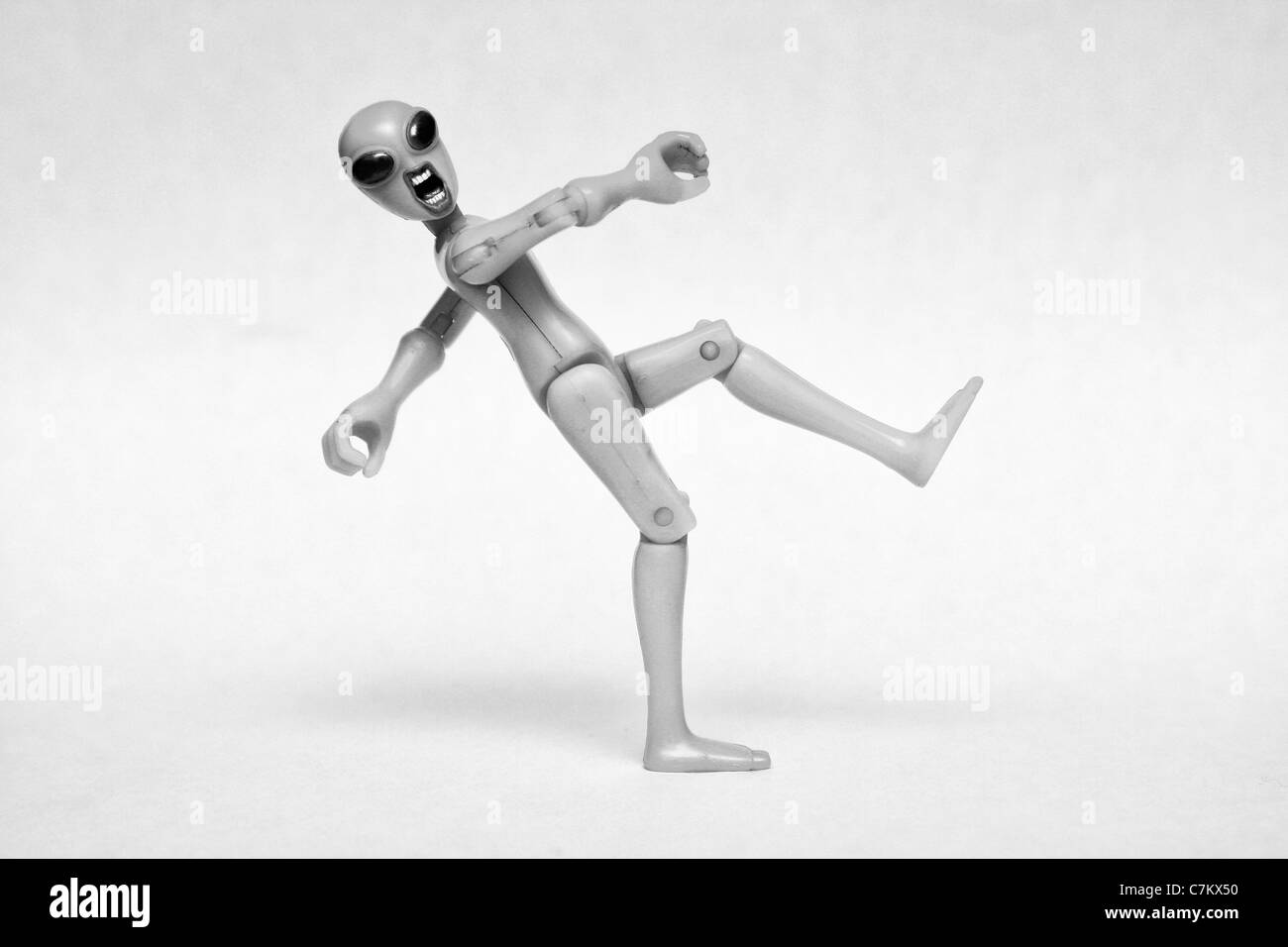 plastic alien toy with superimposed human mouth Stock Photo - Alamy