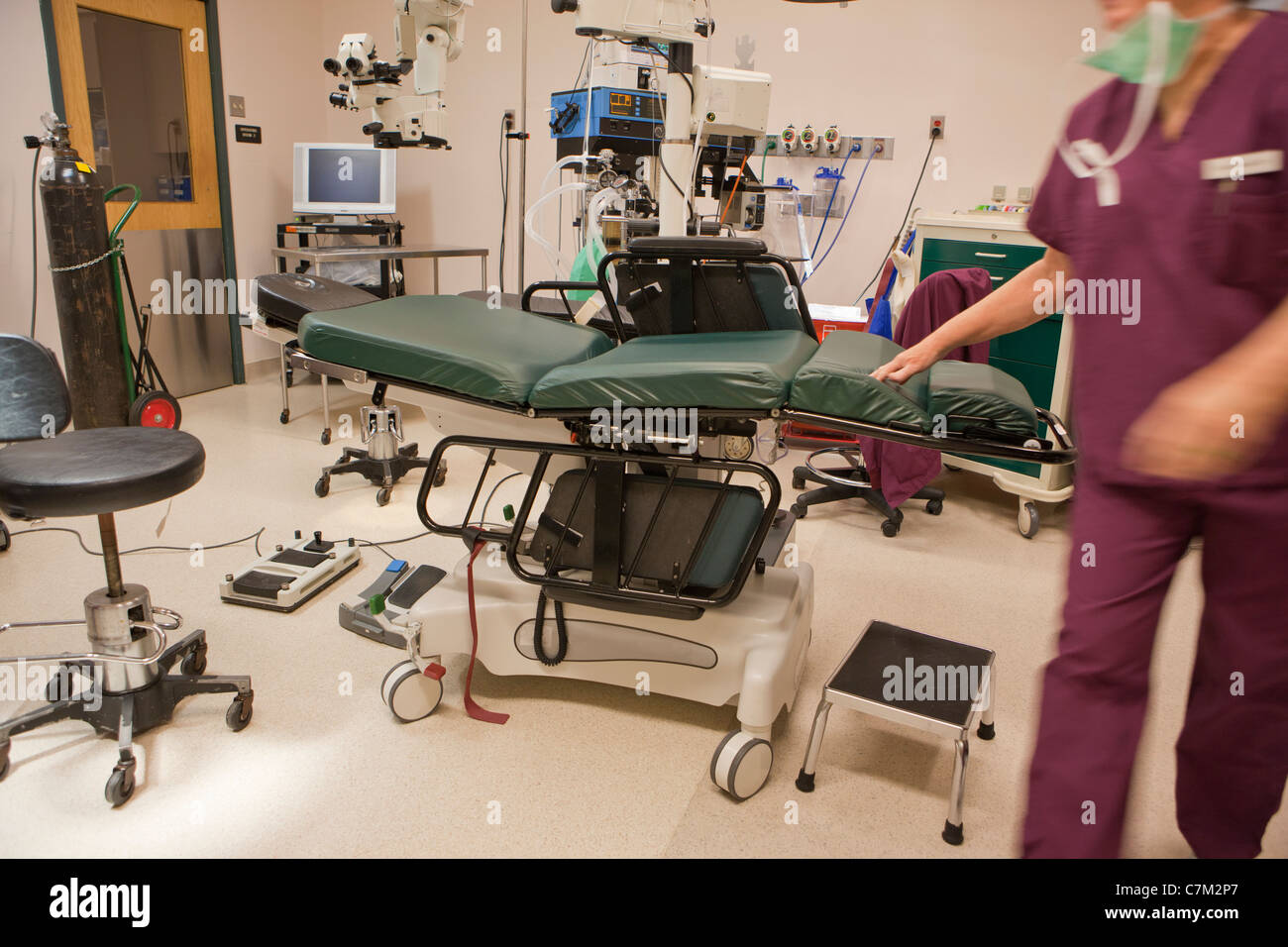 Surgical technologist getting operating room ready for next case Stock